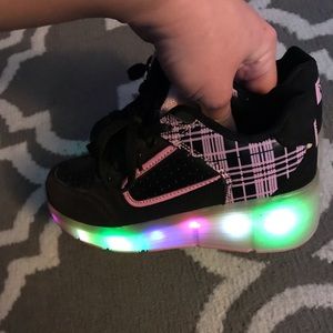 Light up changing color shoes with wheels. Used 2x